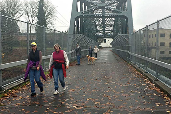 People walking on the Pedestrian Bridge