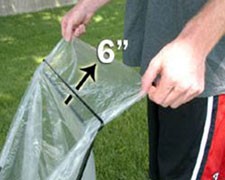 Man pulling bag through the slot