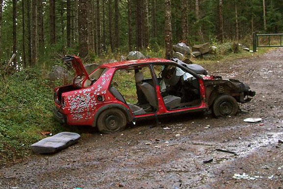Abandoned car in a forest
