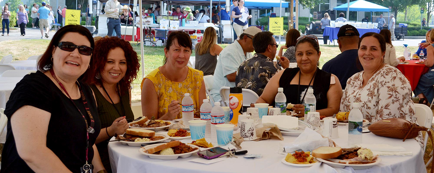 employees at a picnic table