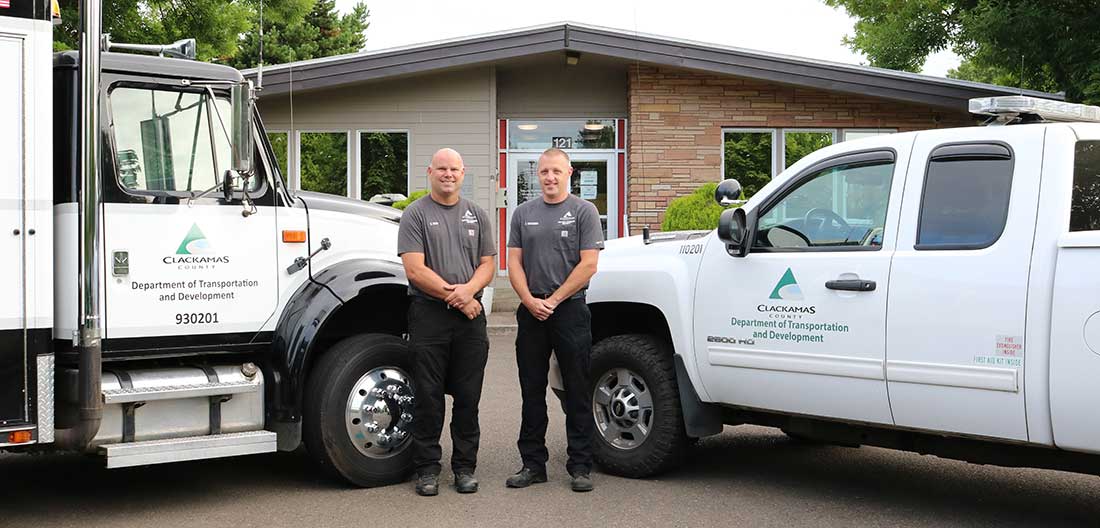 DTD Employees standing by trucks