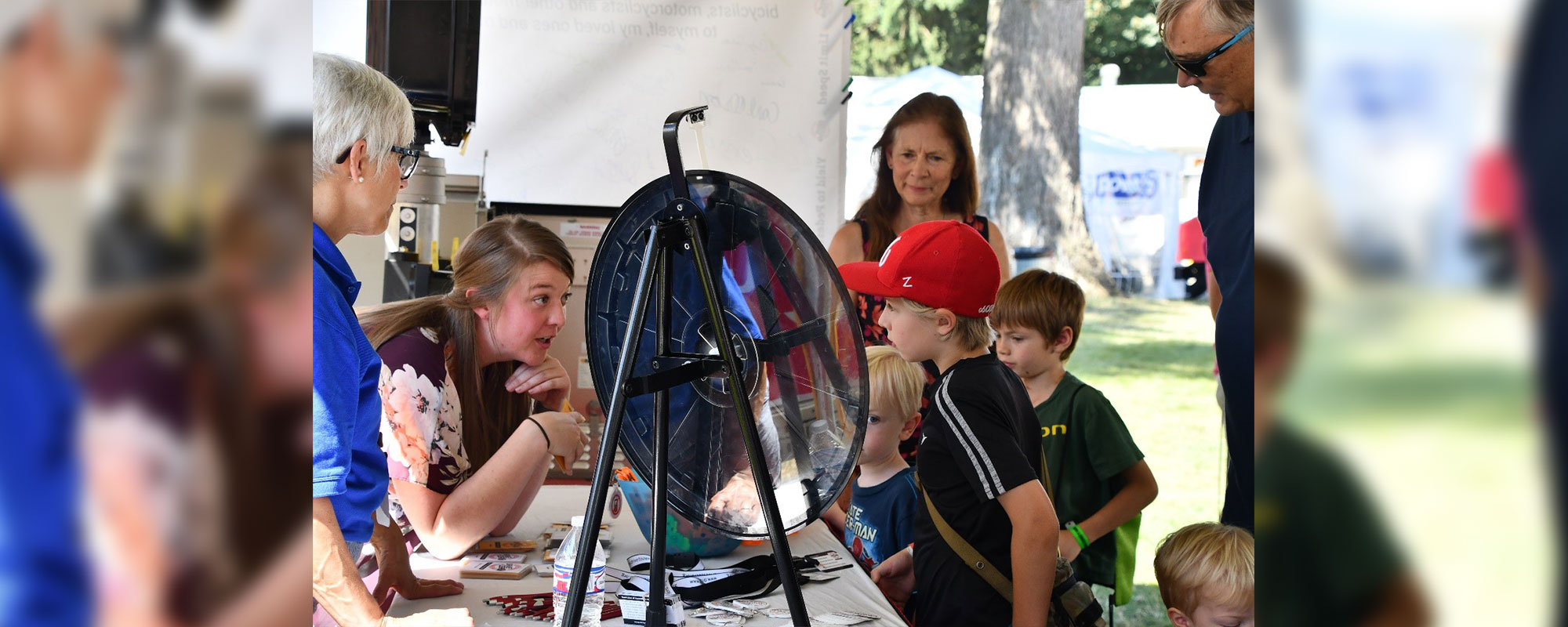 Children spinning a wheel and learning about safety