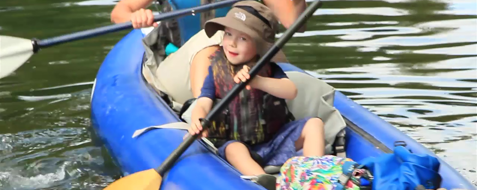 Little boy canoeing