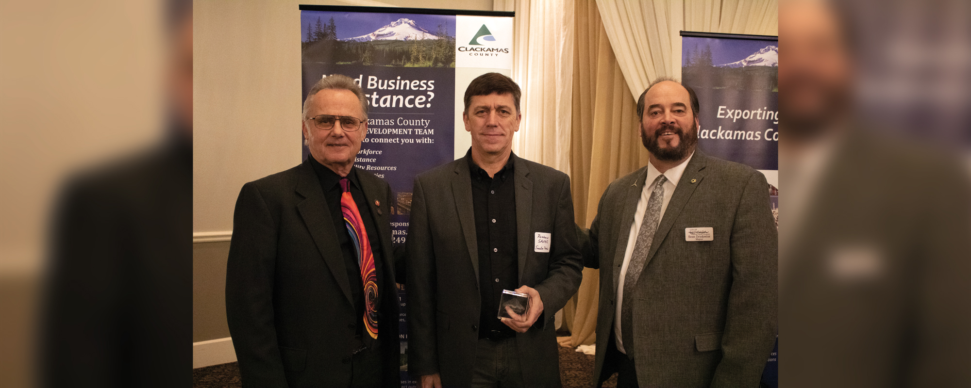 Clackamas County Commissioner Ken Humberston and Estacada Mayor Sean Drinkwine welcome cross-laminated timber manufacturer Sauter Timber to the Clackamas County family.