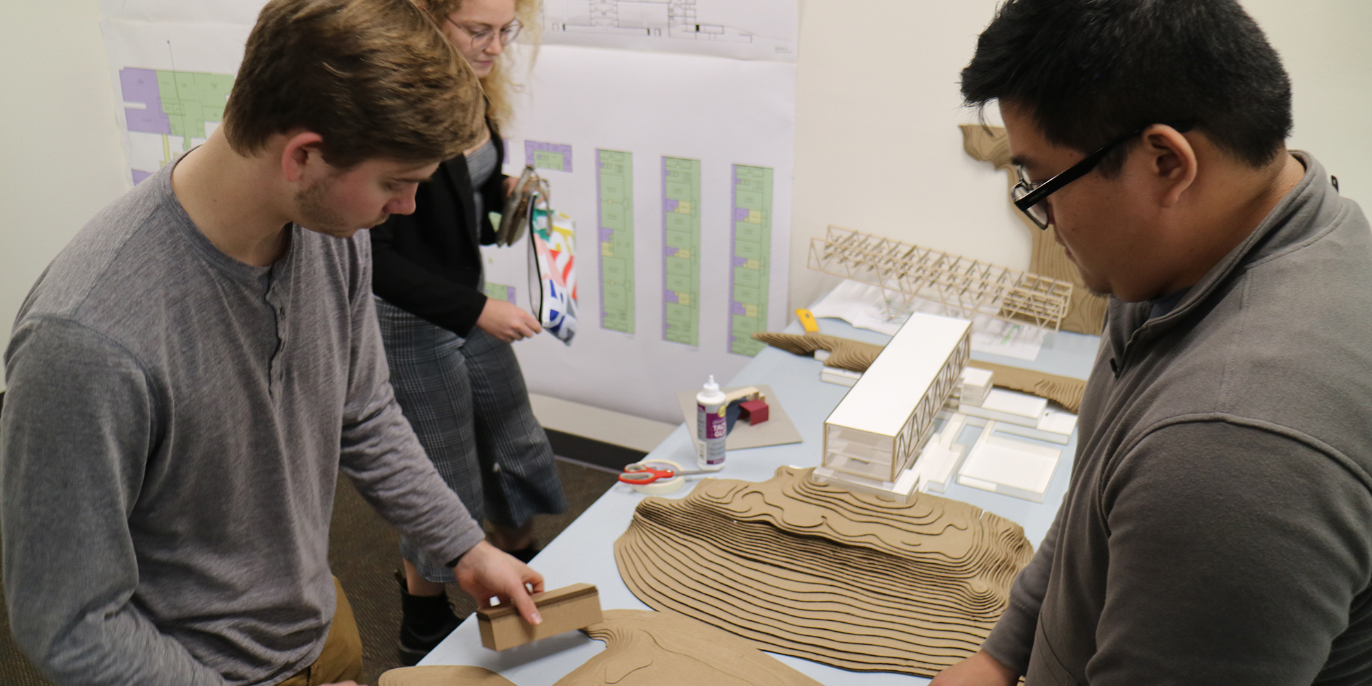 Architecture students from the University of Oregon put the finishing touches on their courthouse design before presenting them to Clackamas County staff. 