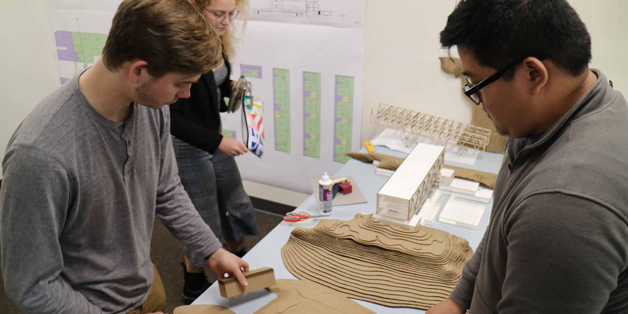 Architecture students from the University of Oregon put the finishing touches on their courthouse design before presenting them to Clackamas County staff.