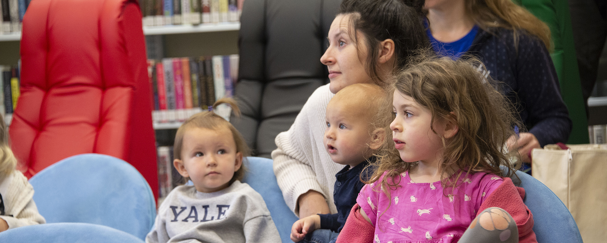 small children listen intently to storytime