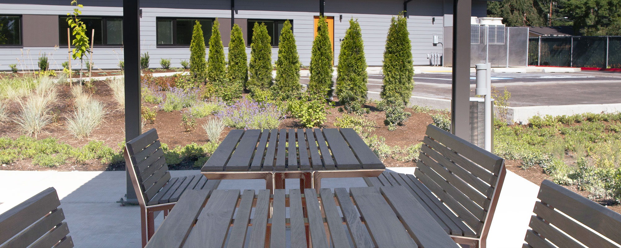 Covered tables and seats outside of the Tukwila Springs building