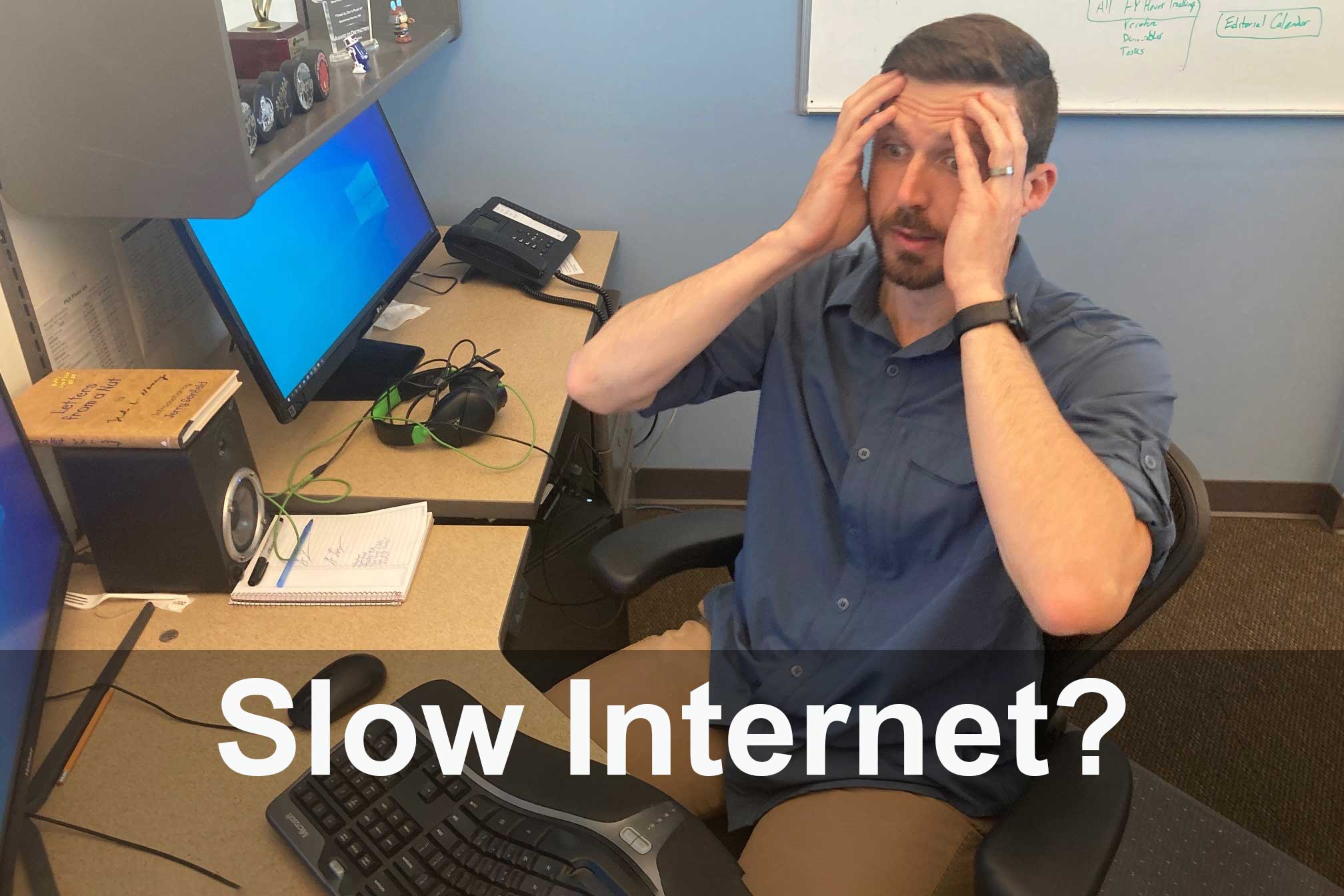 man holding head- slow internet