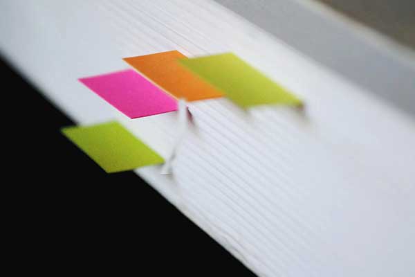 Stack of files with colored bookmarks