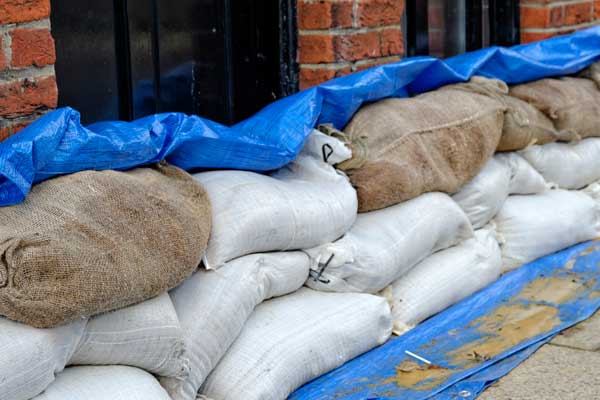 Sandbags stacked against wall