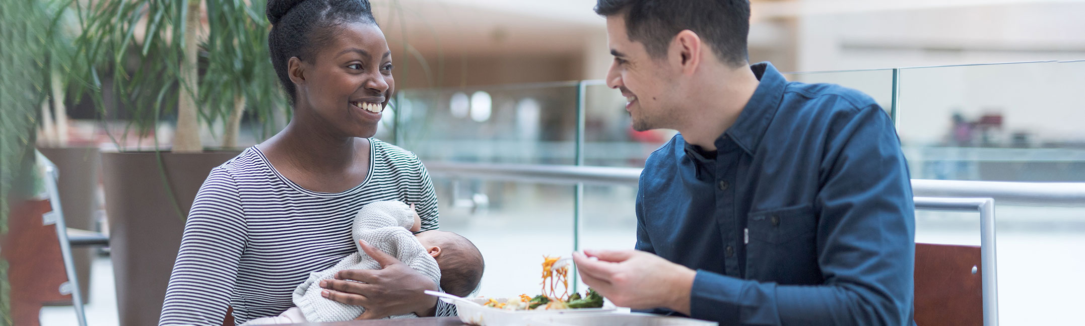 Mother breastfeeding in a restaurant