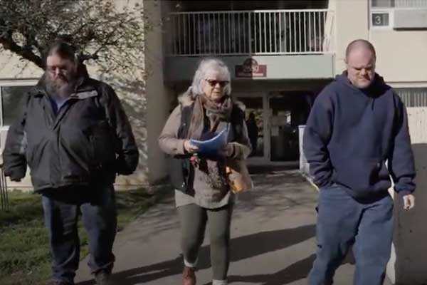 Berta, Curtis and Mitch leaving a building