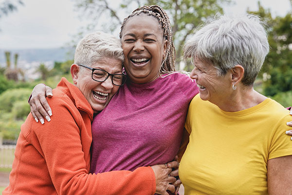 Multiracial senior women having fun together after sport workout outdoor