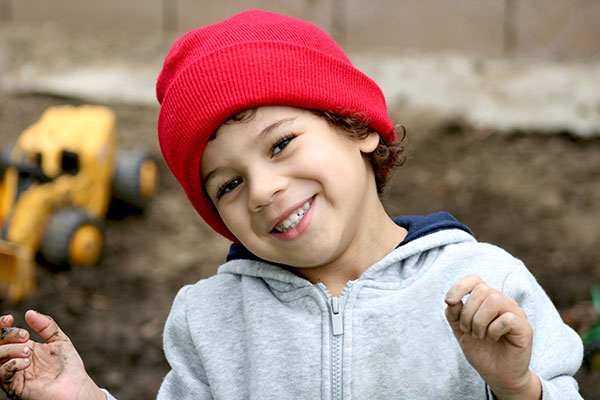 child with red stocking cap