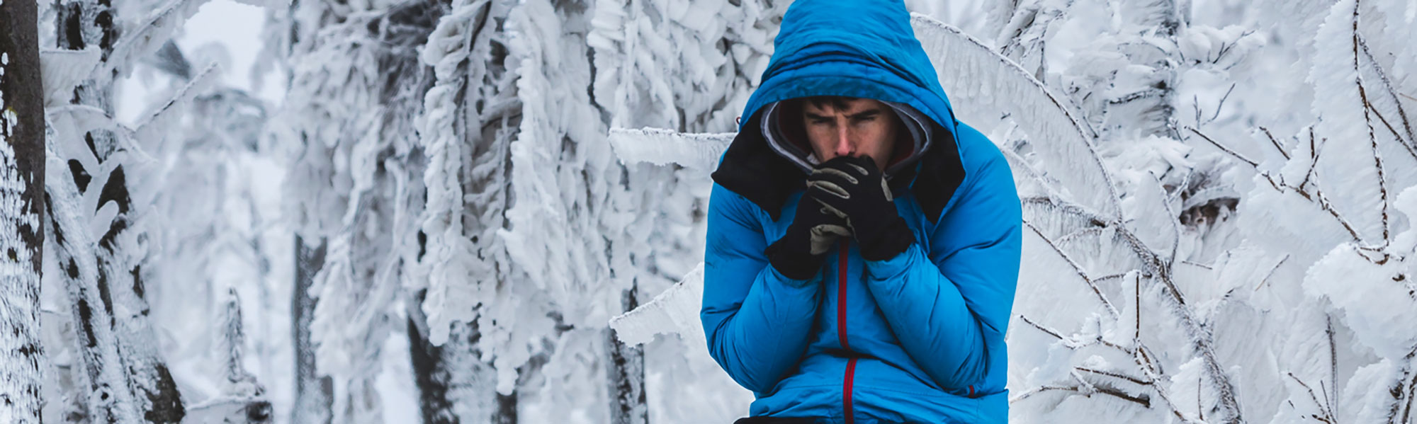 Man shivering in the snow