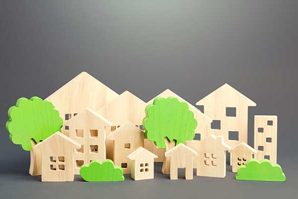 Wood cutouts of houses and apartments