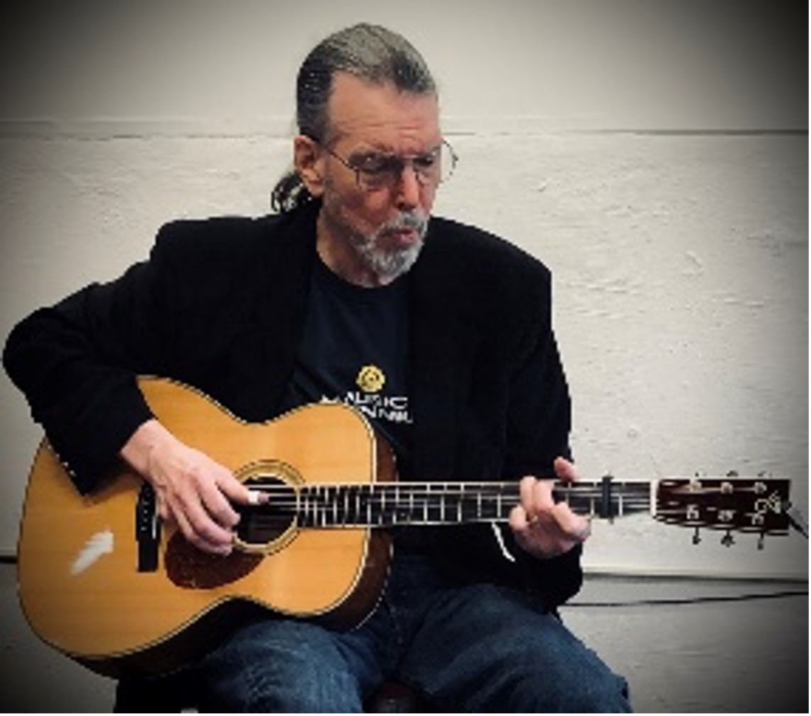 Howard Wade playing the guitar