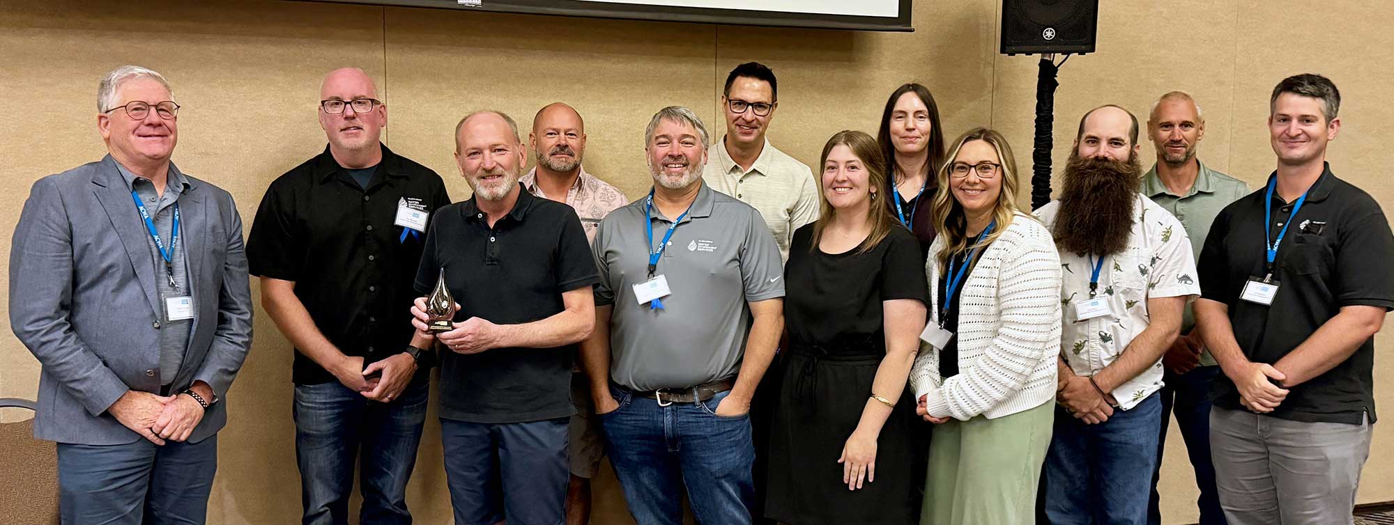 WES staff receive the 2025 Outstanding Member Agency Award at the annual conference in Bend, Oregon