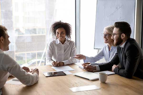 group of people having a discussion at a table