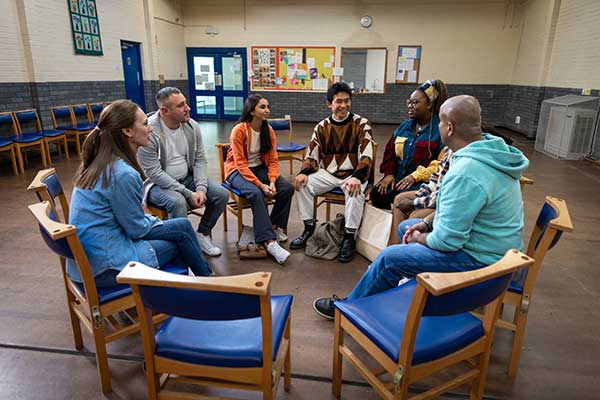 group of people in a circle talking