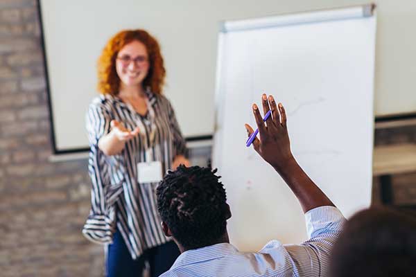 women teaching in front of class