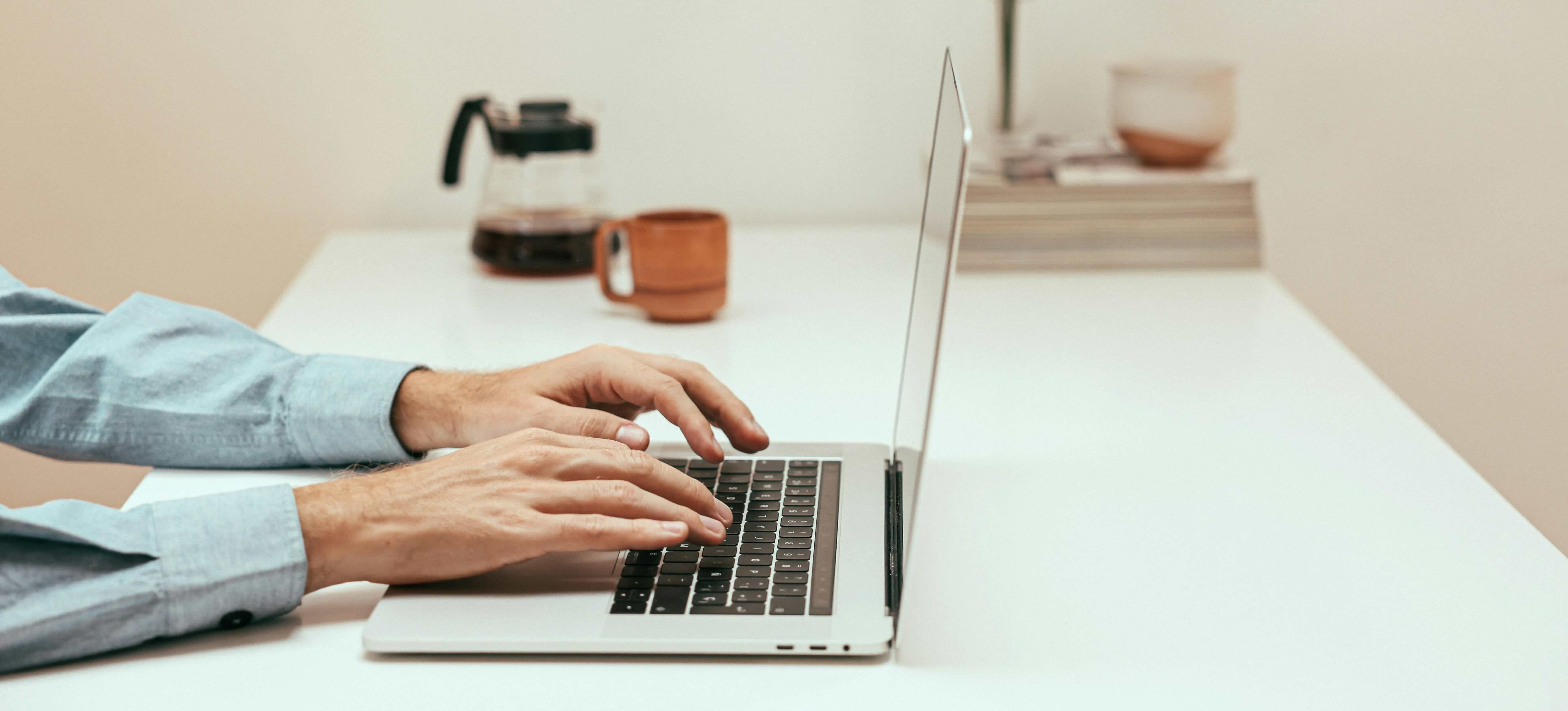 Person typing on laptop