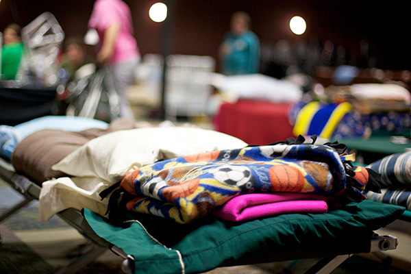 Blankets on a cot at a warming center