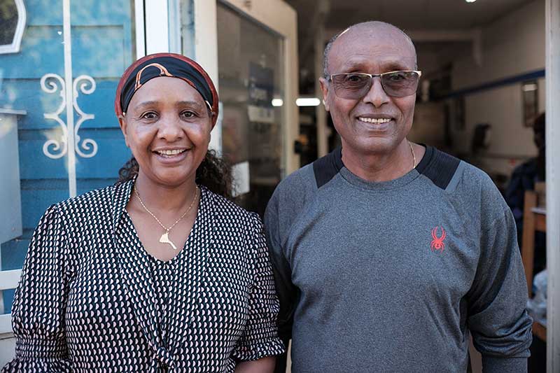People standing outside the Little Blue Store