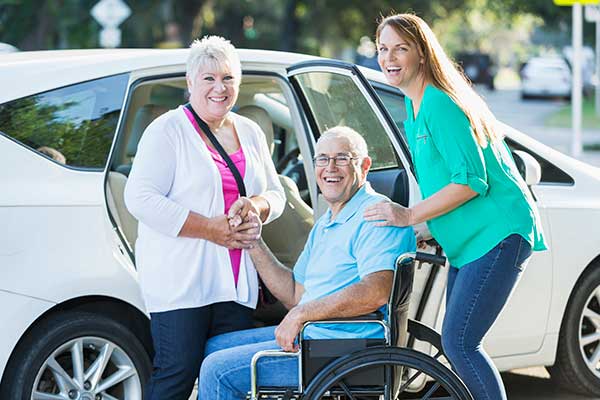 older man in wheel chair smiling