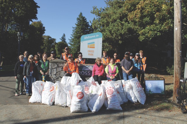 group of people at a park clean up