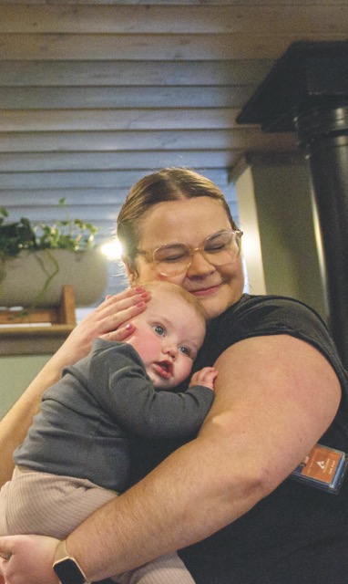women holding a baby