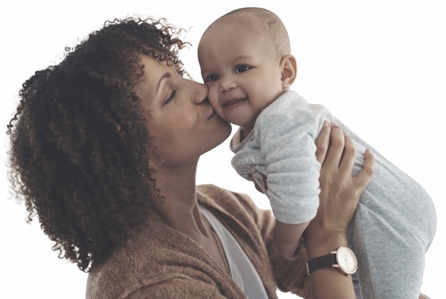 mother holding a baby