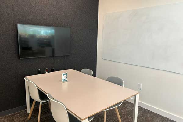 room with a table and tv screen