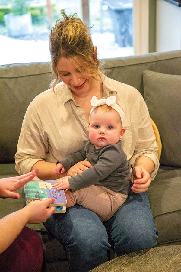 women holding a baby