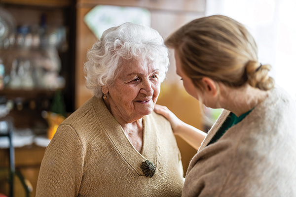 younger women helping senior women