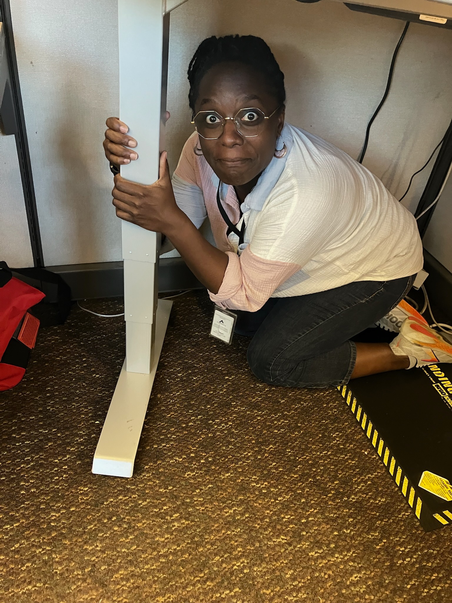 Woman under a desk