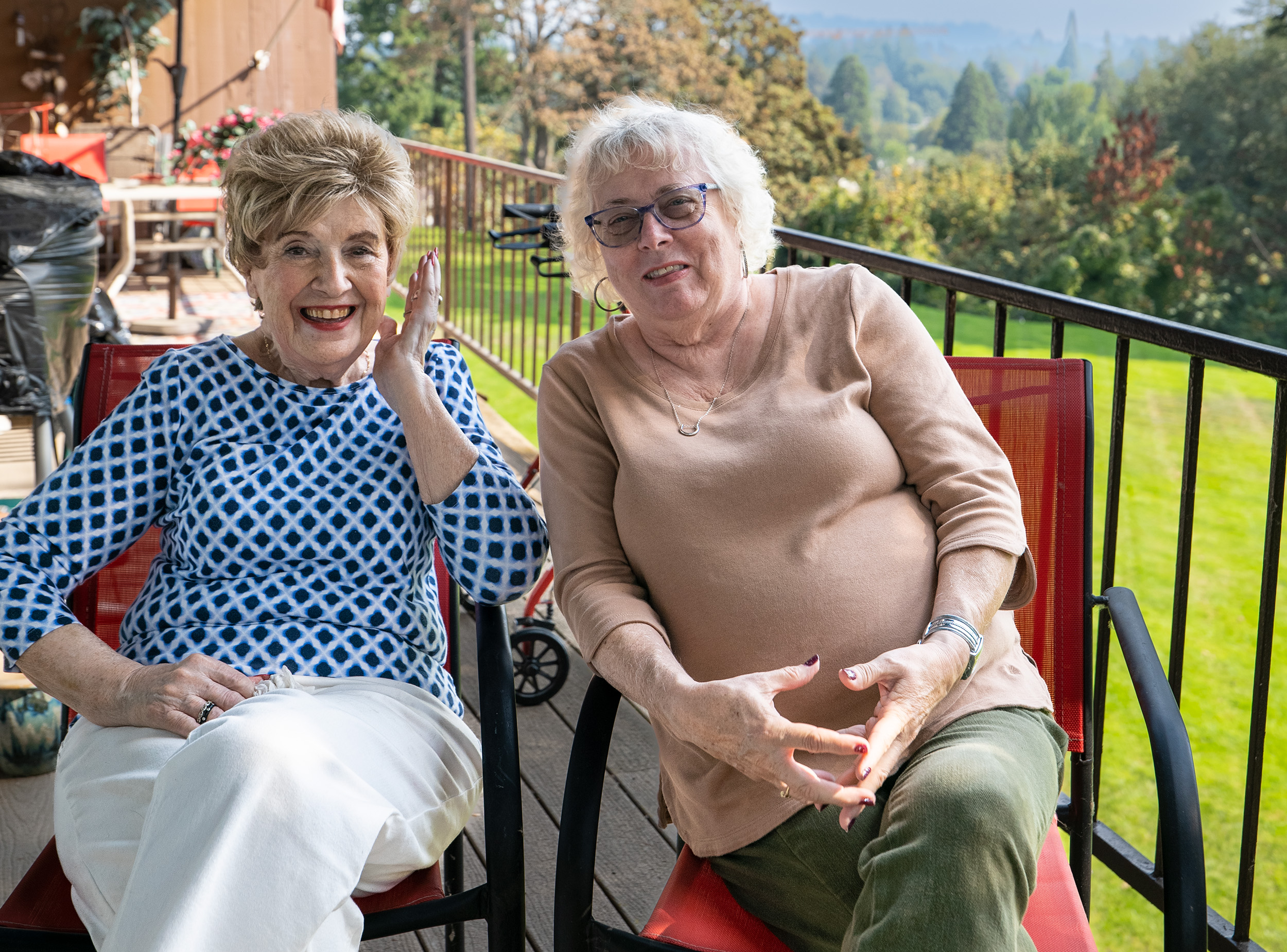 Senior Companion Program volunteer Ellen Morgan (right) provides companionship and reading support to client Trevalee Johansson.