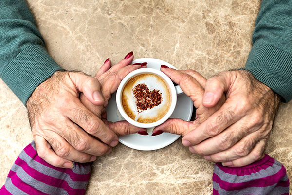 Senior couple drinking morning coffee together