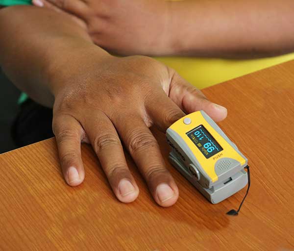 Using a pulse oximeter to check blood oxygen levels