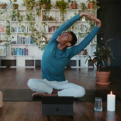 Man doing yoga in his apartment