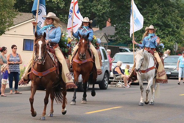 The Rodeo Court riding down Mainstreet