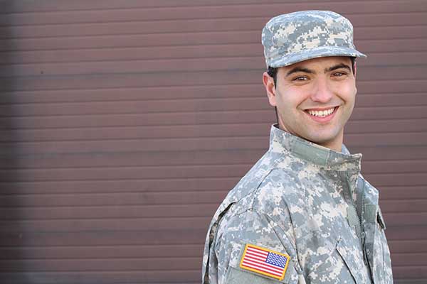 Smiling man in military uniform