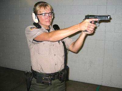 Deputy firing a pistol
