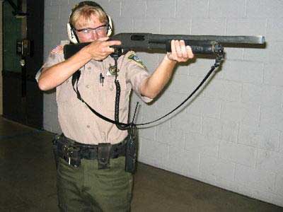 Deputy firing shotgun