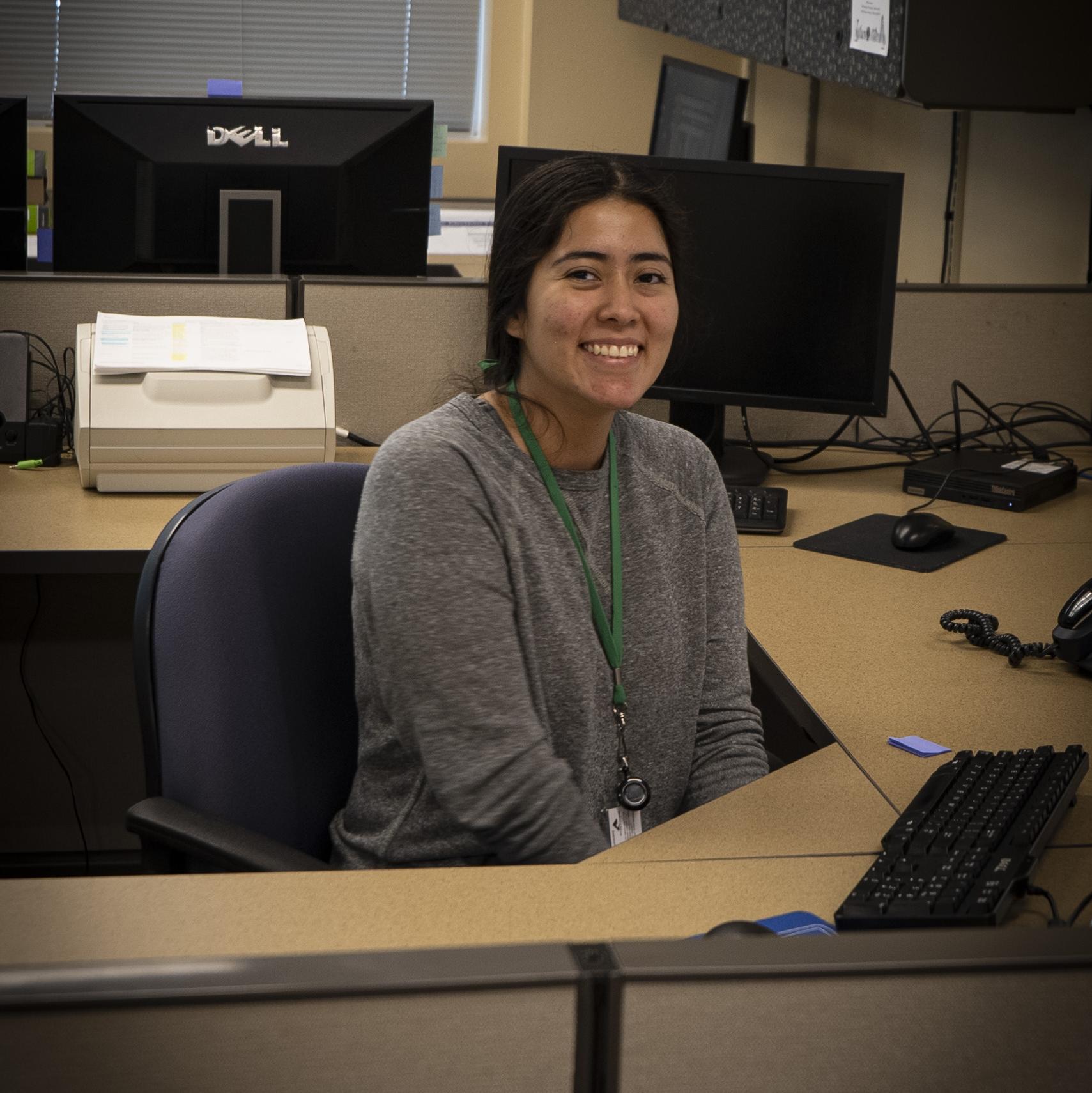 An elections worker is available to help voters at the front counter in the elections office.