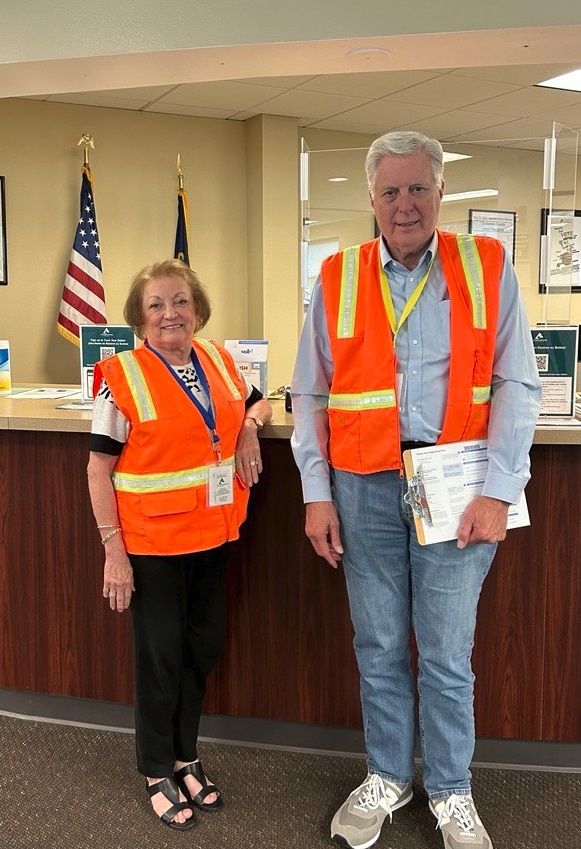Elections workers welcome voters into the Oregon City Office