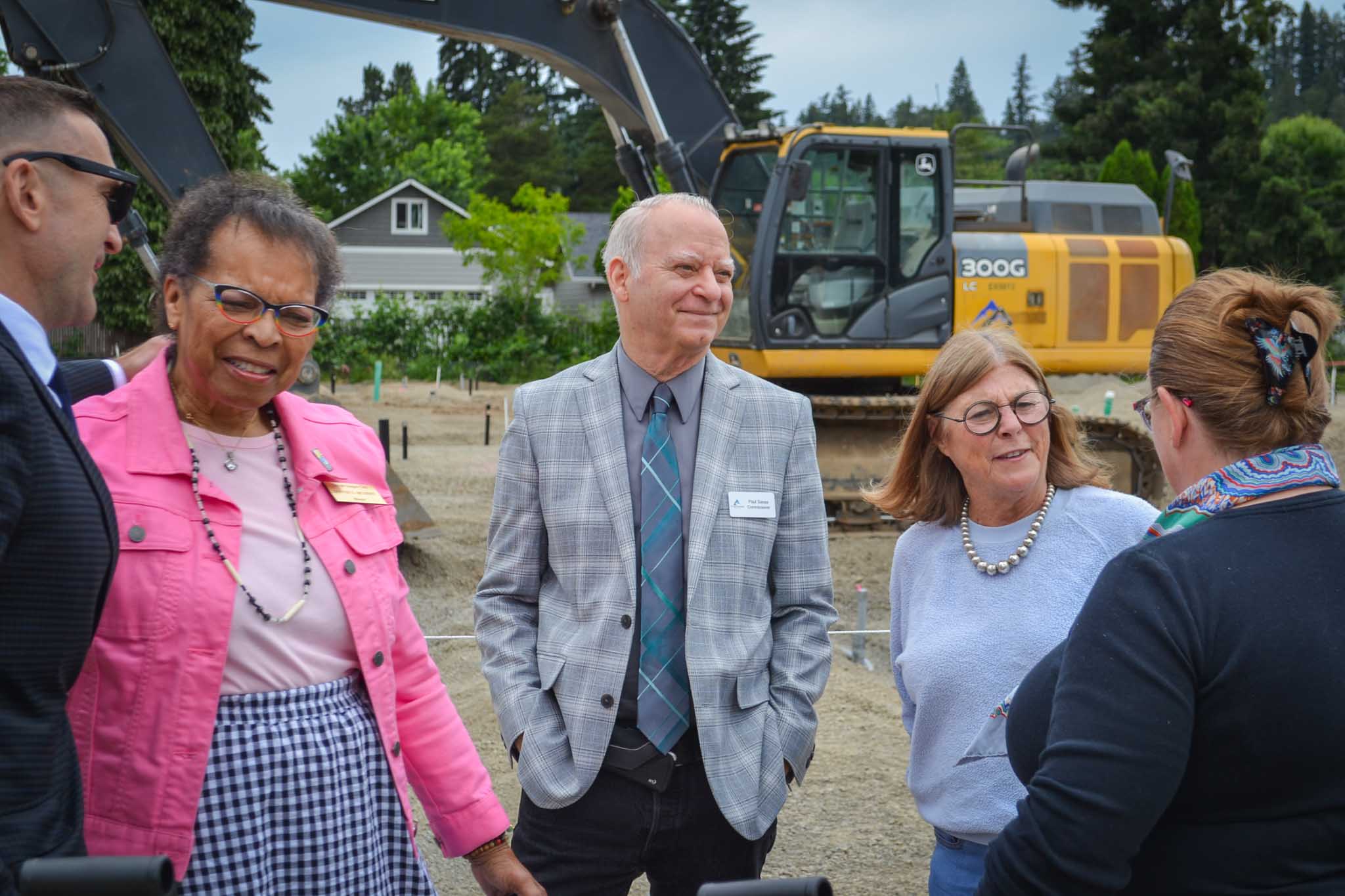 Clackamas County Commissioners Martha Schrader and Paul Savas speak with Oregon City Mayor Denyse McGriff on construction site