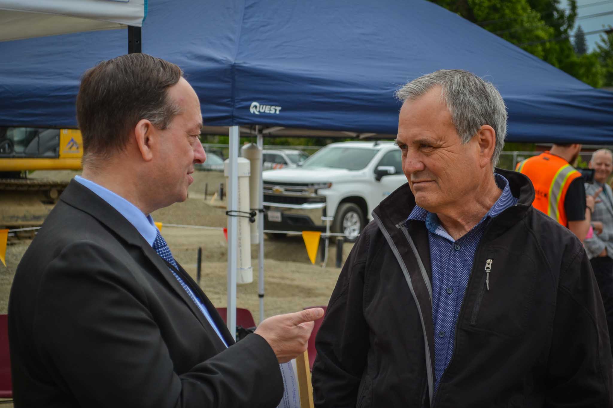 Two men talking at construction site