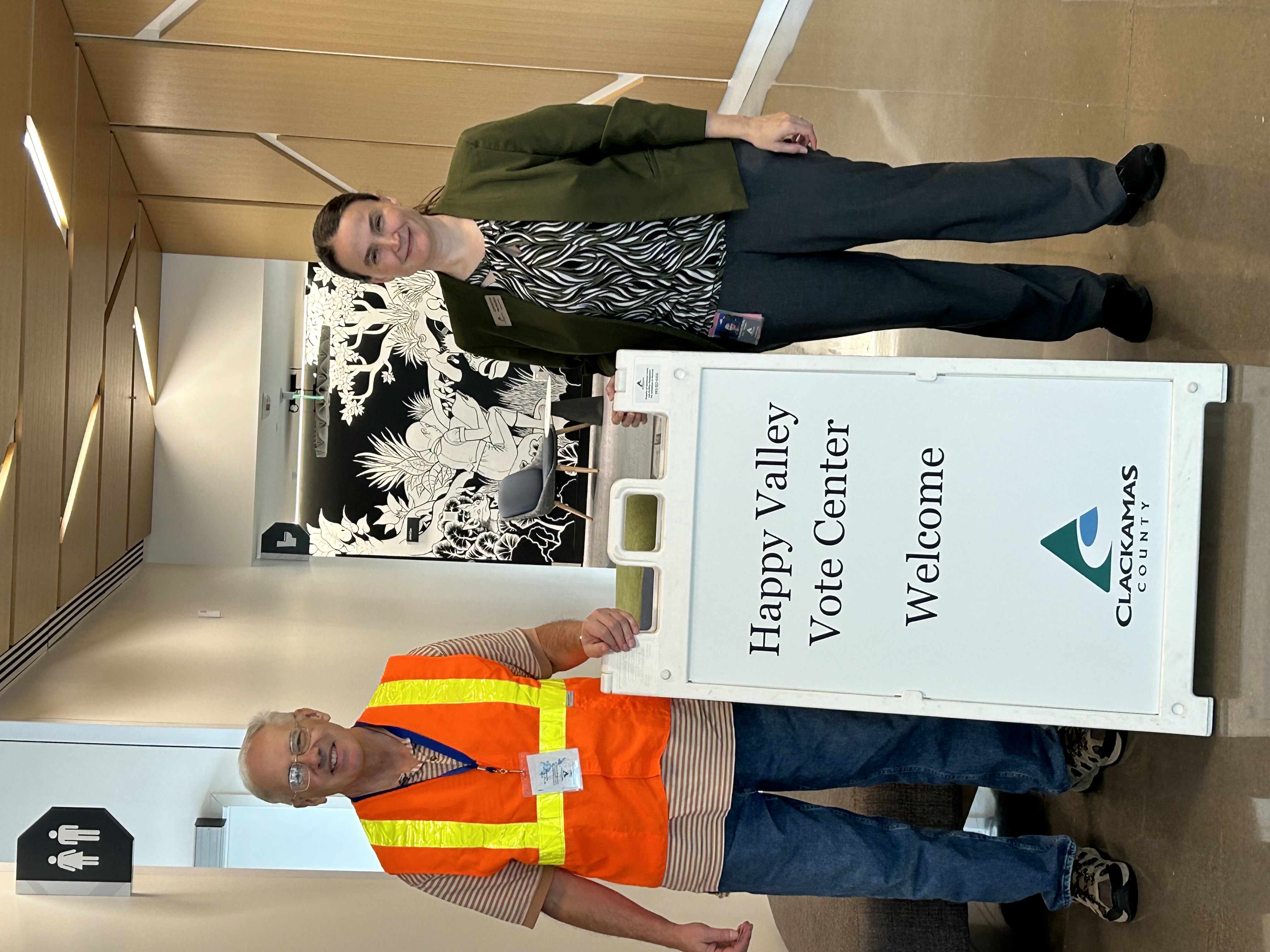 Clerk McMullen and staff welcome voters to the Happy Valley Vote Center in the library